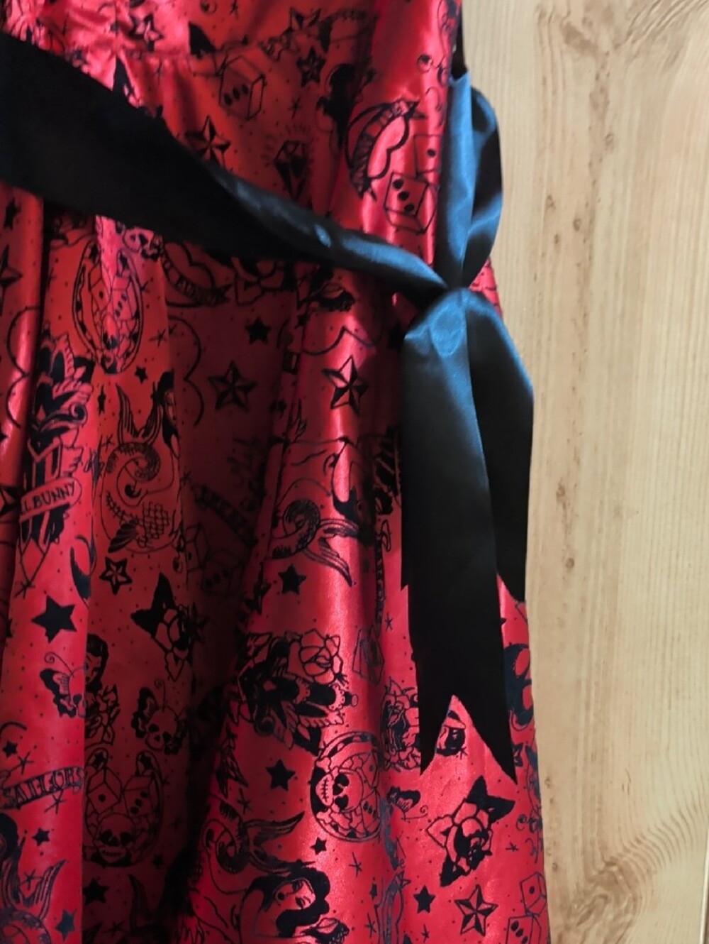 Hell Bunny Red Satin High-Low Dress with Black Trim and Bow Accents - Picture 3 of 9